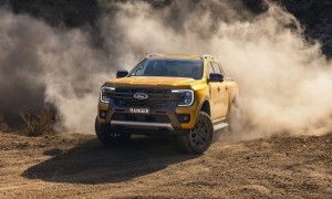 2022Ford_NextGenRanger_Wildtrak_Front3QTR_motion_sand