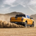 2022Ford_NextGenRanger_Wildtrak_Rear3QTR_motion_sand